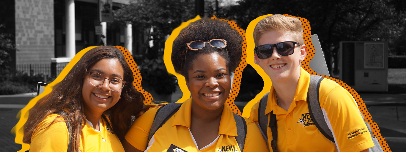three orientation leaders smile for a photo